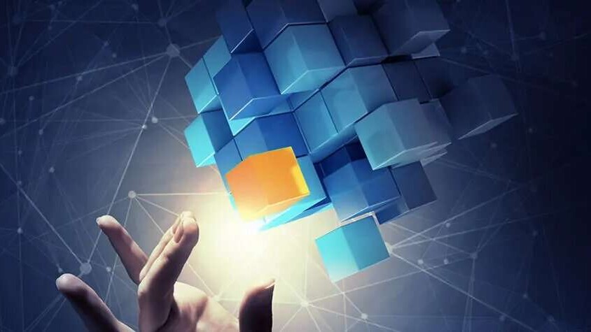 Cubes floating in space with a hand reaching out to touch them