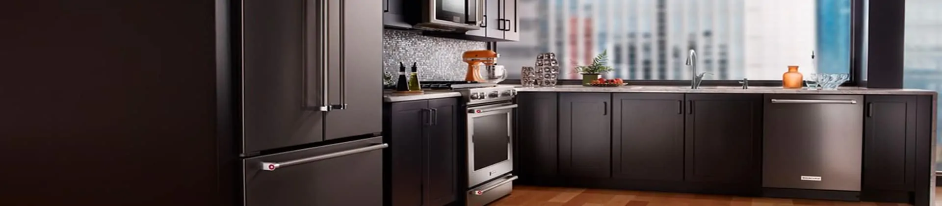 Kitchen with various major appliances like an oven